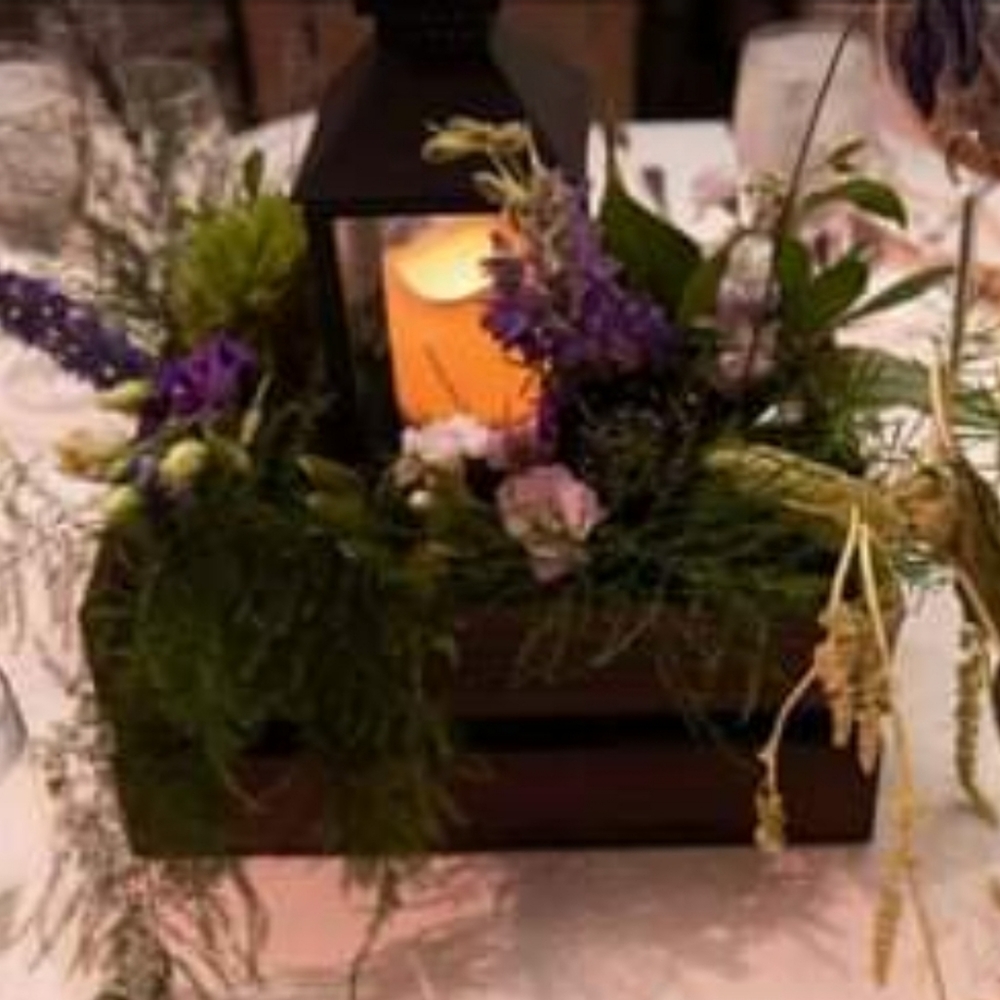 Centerpieces with artificial flowers.